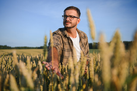 Portrait of farmer in wheat field.