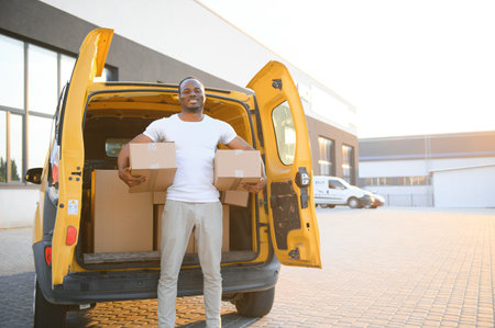 Smile african male postal delivery courier man in front of car delivering package.