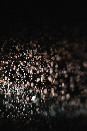 Beautiful wedding rings on light backgroundの写真素材