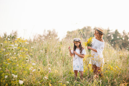 Young mother and her daughter have fun, mother's day.の写真素材