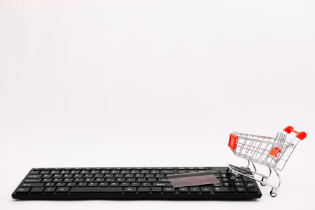 online shopping or internet shop concepts, with shopping cart symbol. isolatedの写真素材