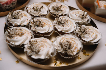 desserts with fruits, mousse, biscuits. Different types of sweet pastries, small colorful sweet cakes, macarons, and other desserts in the sweet buffet. candy bar for birthday.の写真素材