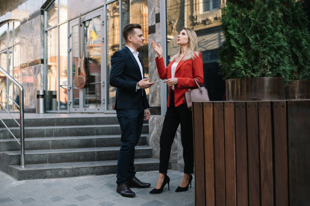 Business people walking and talking in the street.の写真素材
