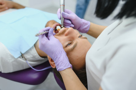 Dental care concept. Handsome young guy at the dentist's officeの写真素材