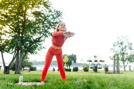 YOGA : Beautiful young woman doing yoga in the summer park. healthy lifestyle. Various yoga postures.の写真素材