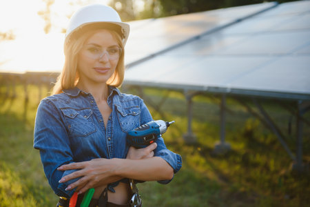 Woman engineer checking solar panels setupの写真素材