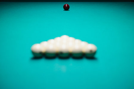 White billiard balls for Russian billiards, in a triangle on the table.