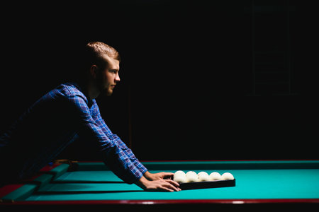 Playing billiard - Close-up shot of a man playing billiard