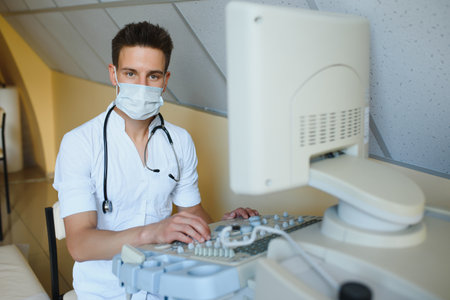 Sonographer using modern ultrasound machine in clinic
