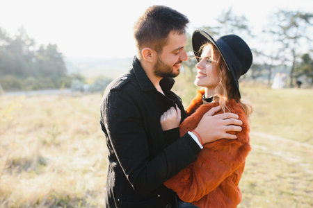Romantic young couple in love relaxing outdoors in parkの写真素材