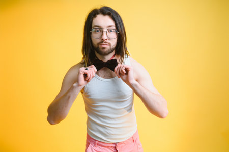 Young, handsome gay man on a colored background in the studio. LGBT conceptの写真素材