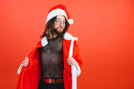 New Year's LGBT party. A gay man in a Santa suit. Concept of Equalityの写真素材