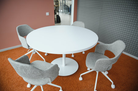 Modern meeting room interior with table and chairs.の写真素材