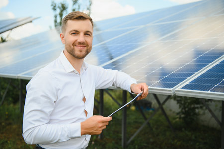 technician checks the maintenance of the solar panels.の写真素材