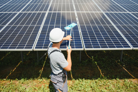 A man working at solar power stationの写真素材