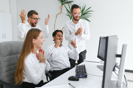 Team at work. Group of young business people in smart casual wear working together in creative...
