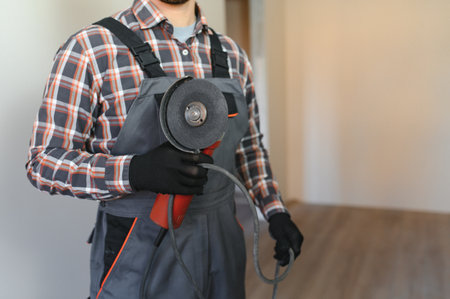 Portrait of a construction worker or repairman in the house.の写真素材