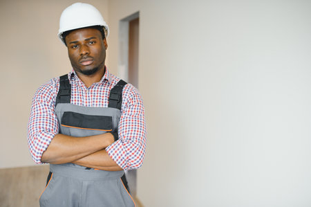Young cheerful African American repairman.の写真素材