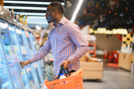 African American man shopping in food store.の写真素材