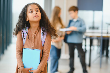 Portrait of cute African-American girl at school.の写真素材