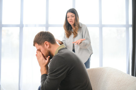 Family conflict, quarrel, misunderstanding. The woman shouts at her husband, in despair, crying.の写真素材
