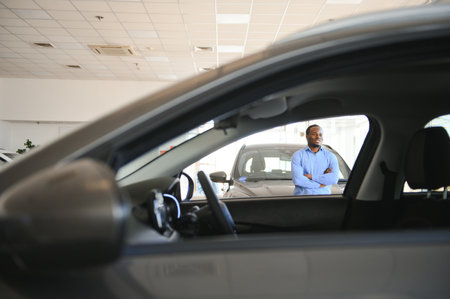 Car Buyer. Black Guy Choosing New Automobile In Dealership Store.の写真素材