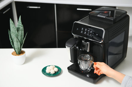Modern coffee machine in kitchen,