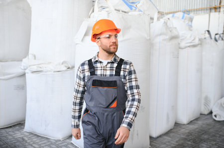 Portrait of factory worker. Young handsome factory worker.
