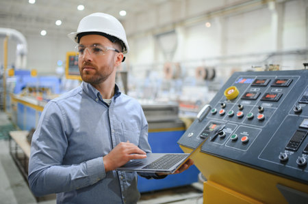 Portrait of a confident handsome technical engineer in hardhat