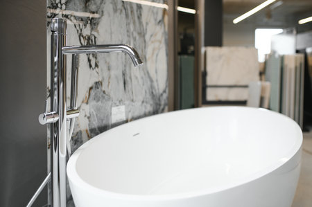 Interior photography of plumbing establishment where tiles, bathtubs, furniture and toilets are sold.の写真素材