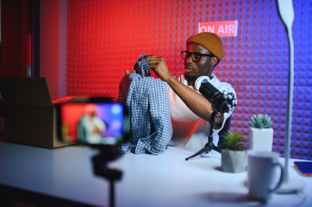 Black male influencer creates material for his internet audience, discussing new trends.