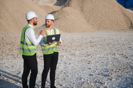 Engineers at a stone crushing plantの写真素材