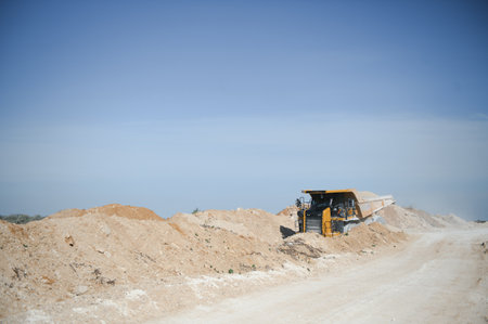 Large quarry dump truck. Big yellow mining truck at work site.の写真素材