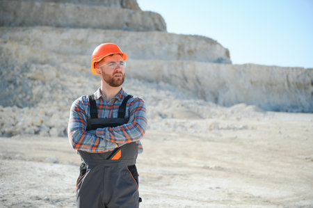 Male worker with bulldozer in sand quarry.の写真素材