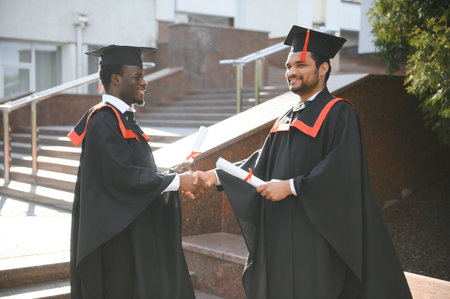Happy boys students university graduatesの写真素材