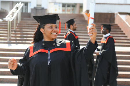 pretty african university graduate at graduation ceremony.