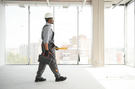 African American engineer at work on construction site.の写真素材