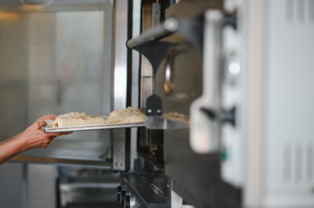 Bakery chef cooking bake in the kitchen professional.の写真素材