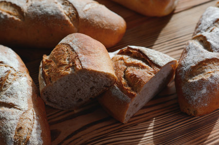 Round bread close-up. Freshly baked sourdough bread with a golden crust on bakery shelves. Baker...