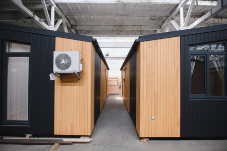 A new wooden modular prefabricated house inside in manufacturing facility.の写真素材