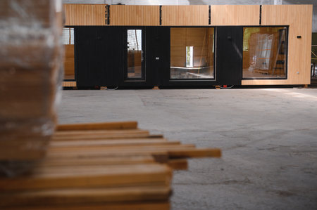 A new wooden modular prefabricated house inside in manufacturing facility.の写真素材