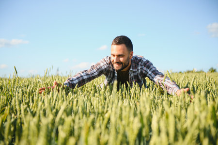 Portrait of farmer standing in wheat field.