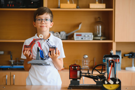 Physics lesson. A student at a desk with scientific instruments and a telescope.