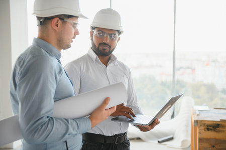 two architect engineers are walking in a constructed office building. implementation of the project.の写真素材