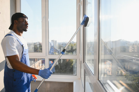 A man cleaning windows. men washes the windows.