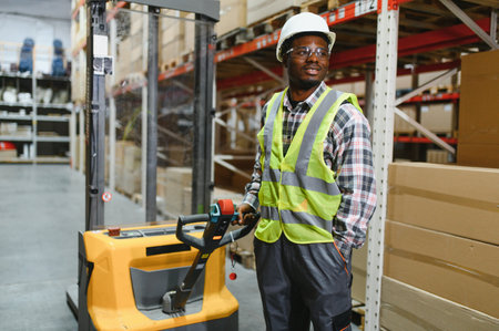 African american Storehouse manager supervising the lift truck operator.の写真素材