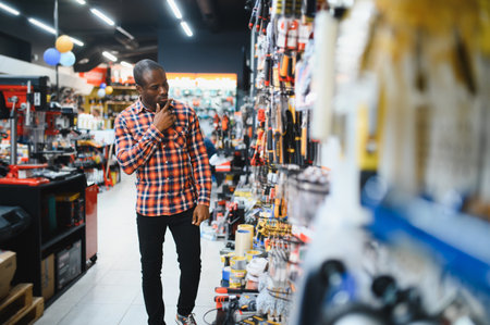 Portrait of a man standing in hardware store.の写真素材