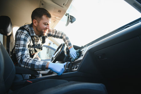 Cleaning the car, cleaning the interior of the car with a microfiber cloth.の写真素材