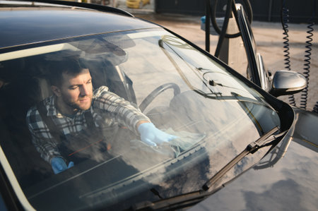 Cleaning the car, cleaning the interior of the car with a microfiber cloth.の写真素材