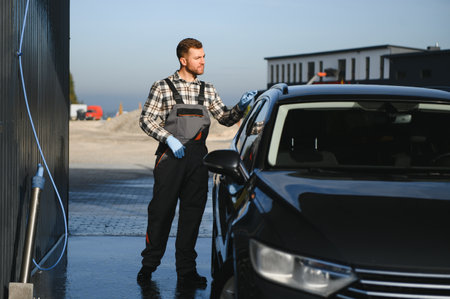 Portrait of a young car wash worker.の写真素材